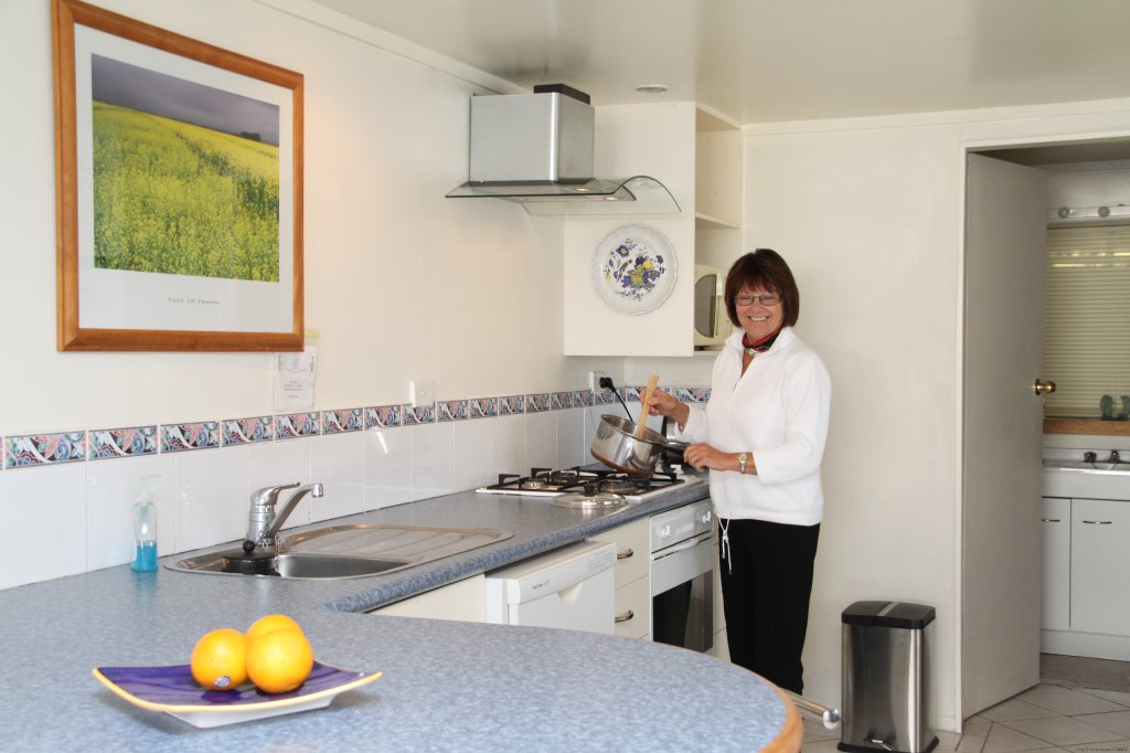 Jay in No 1 Apartment kitchen- with knife | Auckland Number One  House Homestay | Image #11/24 | 