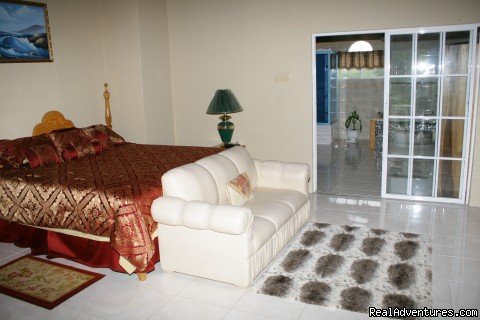 Master bedrom with sliding doors leading to Ensuit bathroom | Ocho Rios OceanView Villa: Free night | Image #5/8 | 