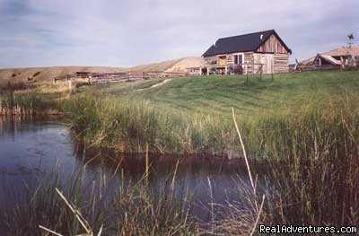 Vintage Log Cabin | Riverfront Cabins on a Private 1400 acre ranch | Image #2/19 | 