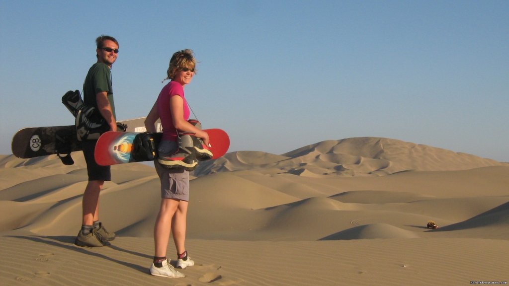 Sand boarding at Huacachina Oasis | Incas & Amazon - Peru Small Group Adventure | Image #11/15 | 