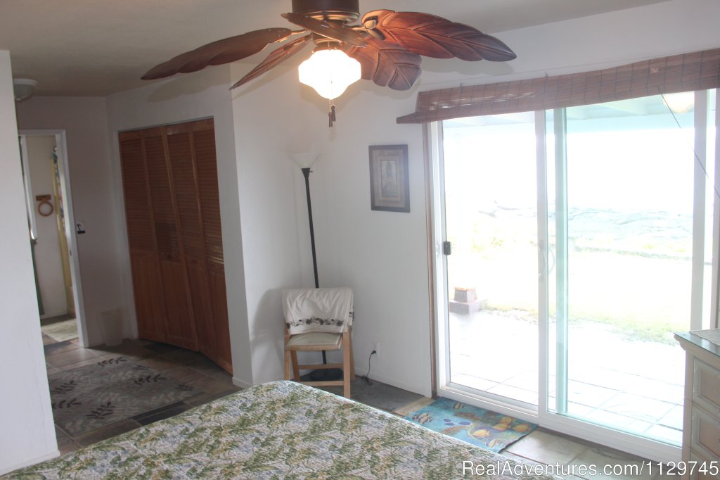 Master bedroom with sliders to lanai and hot tub, ocean view | Big Island Hawaii Vacation Homes at a Great Price | Image #9/26 | 