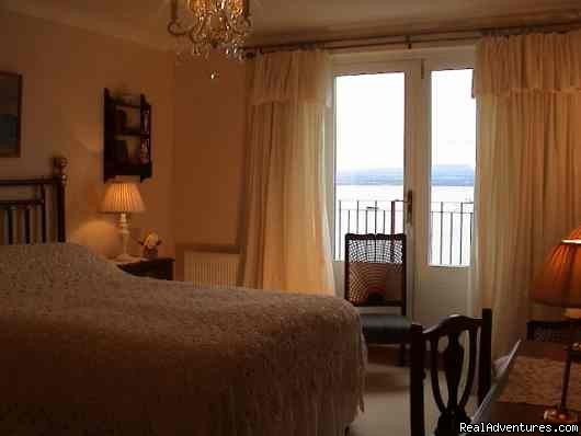 Bedroom 1 and French doors to terrace. | 5 star Water's Edge Bed and Breakfast in Scotland | Fortrose, United Kingdom | Bed & Breakfasts | Image #1/8 | 