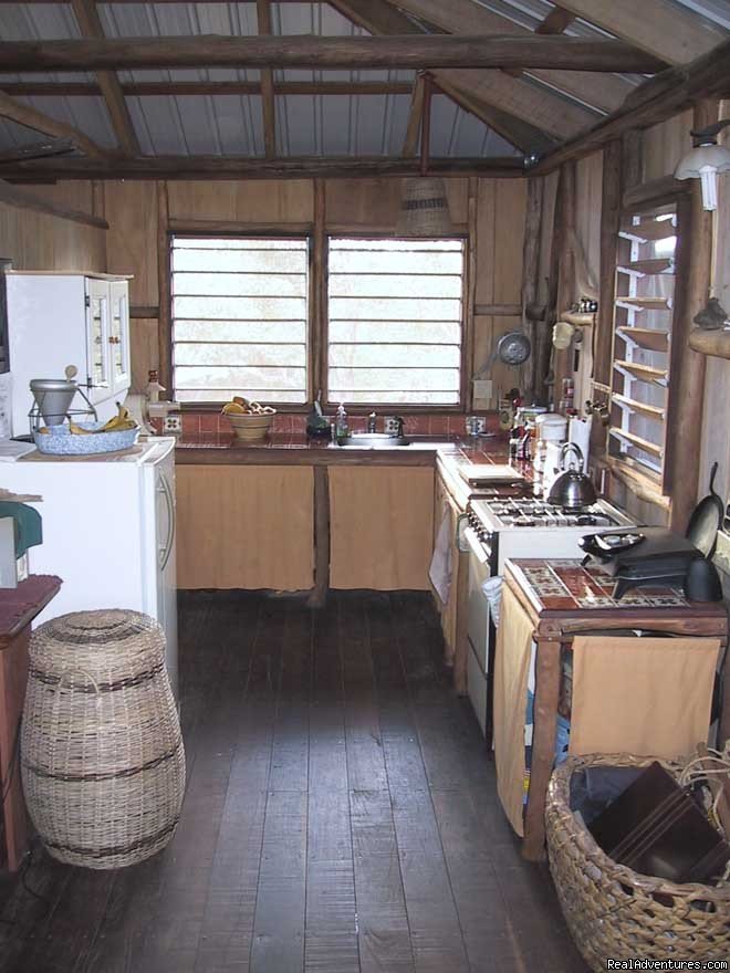 Simple, full kitchen w/mexican tile countertops | Treetop Retreat- An Elemental Belizean Experience! | Image #6/7 | 