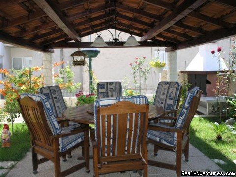 Dining area in the garden | Lux apartment with private garden close the beach | Image #5/10 | 