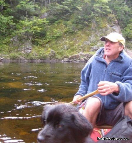 Dr. Paul & Cosmo Canoe on Lake | Cabot Shores Wilderness Resort | Image #13/20 | 