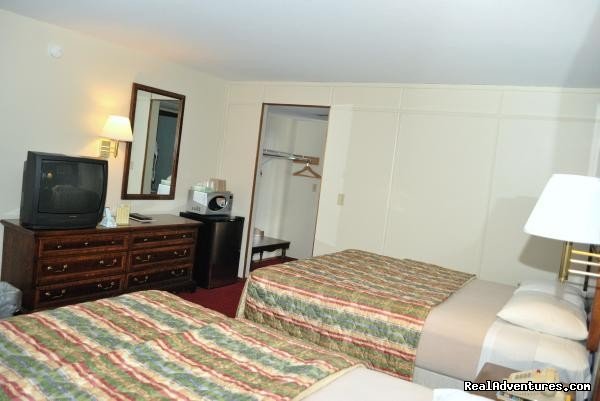 Deluxe 2 Queen Bedroom Side View | Royal Inn | Image #4/8 | 