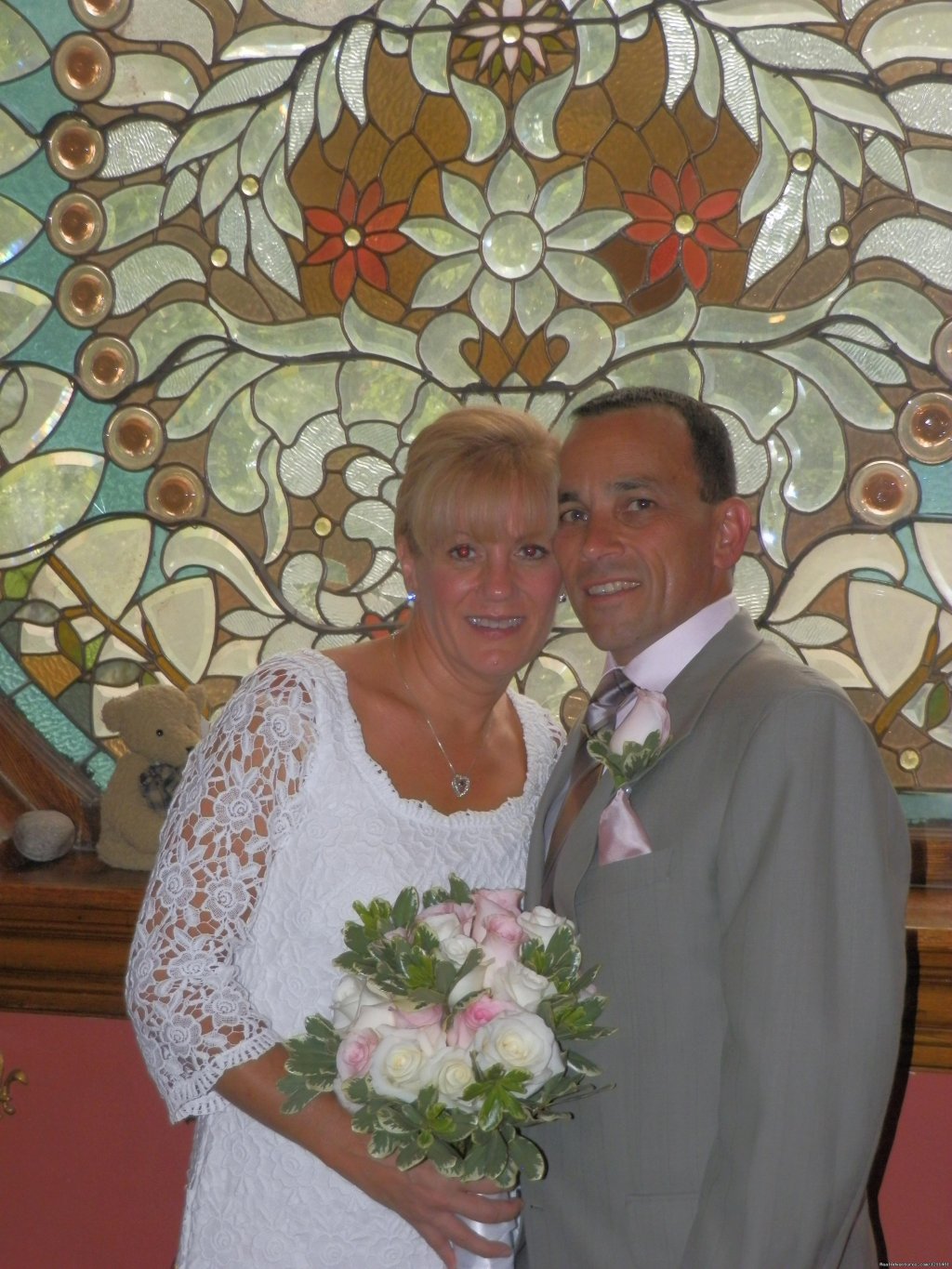 Bride and Groom in front of the Peacock Window | Historic Victorian Castle Marne Bed & Breakfast | Image #11/15 | 