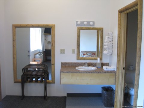 Vanity area out side of full tub shower area 