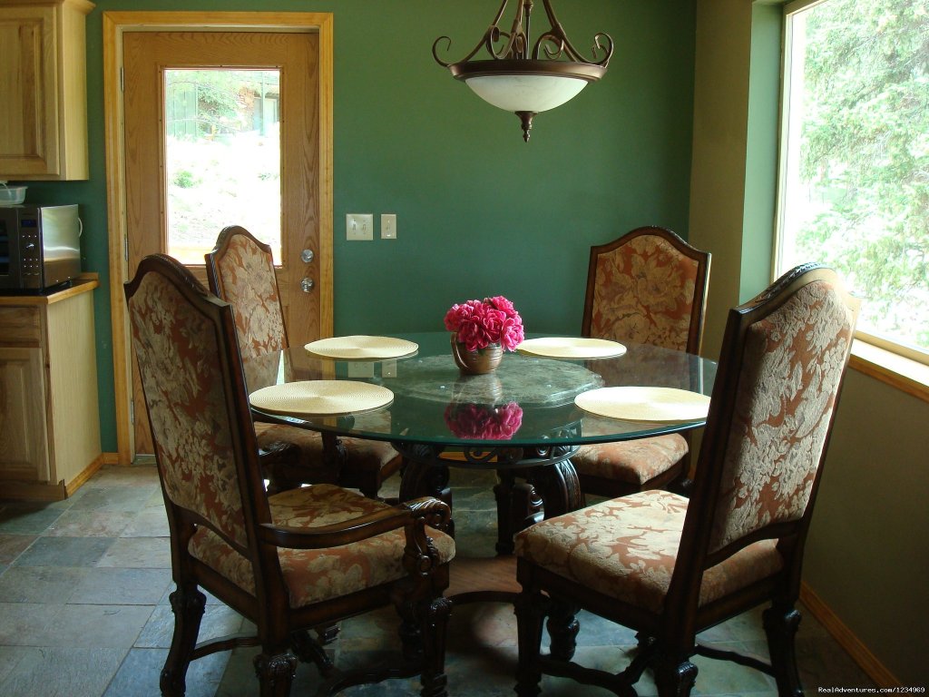 Dining Room has an access to the second deck in the back. | Pikes Peak Retreat In Pikes National Forest | Image #5/26 | 