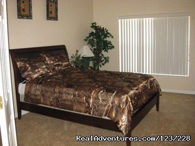 Queen Bedroom | Jungle Retreat, pool home near Disney, wifi & more | Image #4/17 | 