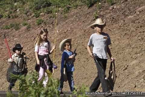 Kid's on the way to the pond to catch some fish