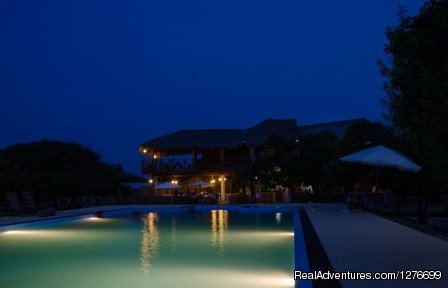 Night View of the main pavilion across the pool.