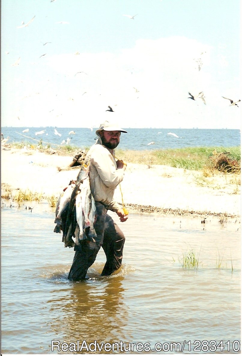 Captain Clay Getting Back To The Island With A Nice Catch | Bayou Log Cabins | Image #11/13 | 