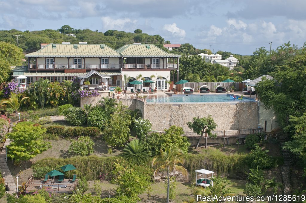 Main House - view from the water - shows Grand Infinity Pool | GrenadaBnB - Luxury Waterfront Villa | Grand Anse, Grenada | Bed & Breakfasts | Image #1/13 | 